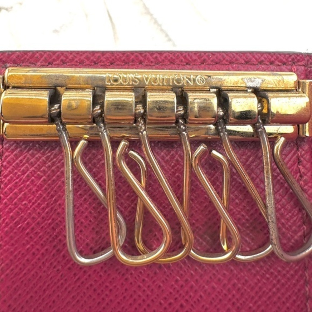AUTHENTIC Louis Vuitton key holder. Monogram pattern. Magenta interior. - Picture 5 of 15